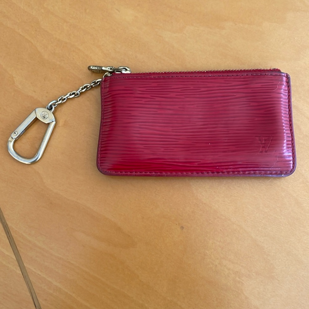 Louis Vuitton red epi leather coin purse with chain.